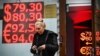  A woman leaves a currency exchange office in Moscow on November 3.