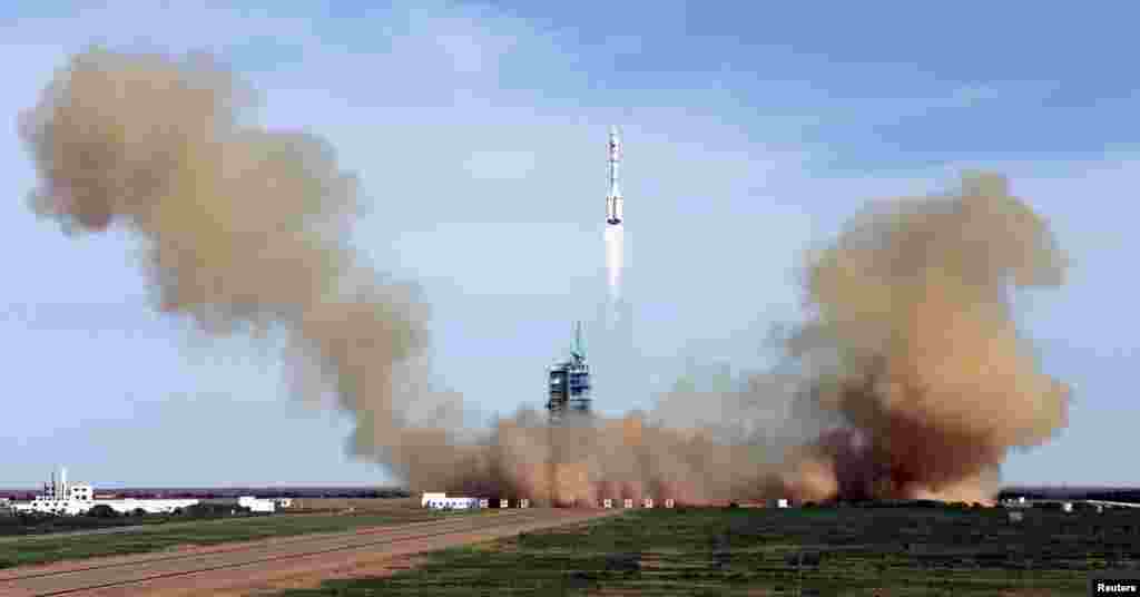 China&#39;s Long March 2-F rocket blasts off with three astronauts onboard for a 15-day mission to an experimental space lab in the latest step toward the development of a Chinese space station. (Reuters)