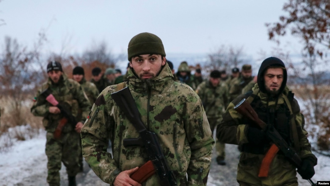 Pro-Russian separatists from the Chechen "Death" battalion walk during a training exercise in the territory controlled by the self-proclaimed Donetsk People's Republic on December 8.
