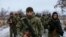 Pro-Russian separatists from the Chechen "Death" battalion walk during a training exercise in the territory controlled by the self-proclaimed Donetsk People's Republic on December 8.