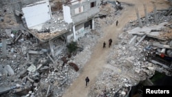 Pentru localități precum Khan Younis, din sudul Fâșiei Gaza, armistițiul vine prea târziu. O fotografie făcută la 16 ianuarie relevă distrugerile făcute de război. 