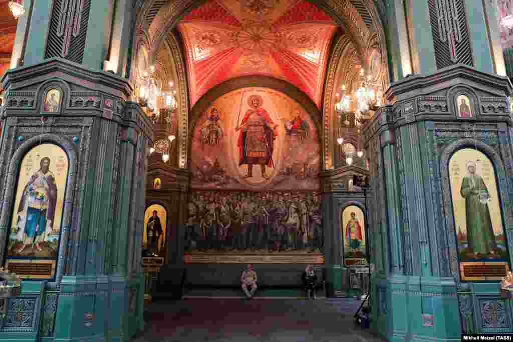 A mosaic on the wall of the cathedral. Earlier this year, leaked photos showed a partially completed mosaic featuring Russian President Vladimir Putin, Defense Minister Sergei Shoigu, and several other Russian officials. The mosaic, along with another depicting soldiers holding a portrait of Stalin, was subsequently removed from the cathedral. &nbsp;