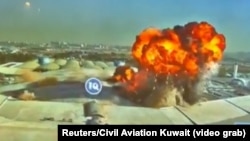 A screen grab from Kuwaiti Civil Aviation footage shows an Iranian kamikaze drone striking the country's international airport on June 3. 