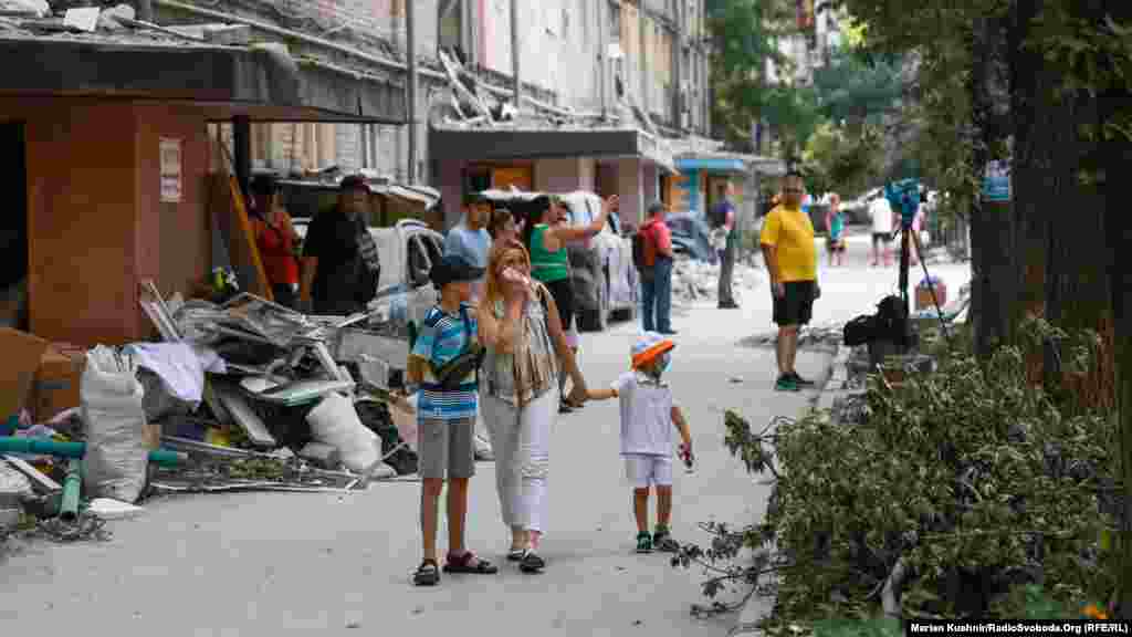 A major Russian drone and missile attack set Kyiv ablaze overnight on July 2, leaving areas across the Ukrainian capital strewn with shattered glass, charred trees, and burnt-out cars.Local resident Olha visited the aftermath in the city's Darnytskiy district with her children. She used to live in a high-rise residential building there that was now partially reduced to rubble following the strikes.