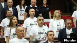 Armenia - Deputies from the opposition Hayastan bloc wear T-shirts emblazoned with pictures of arrested opposition figures during the inaugural session of the recently elected National Assembly, Yerevan, August 2, 2021.