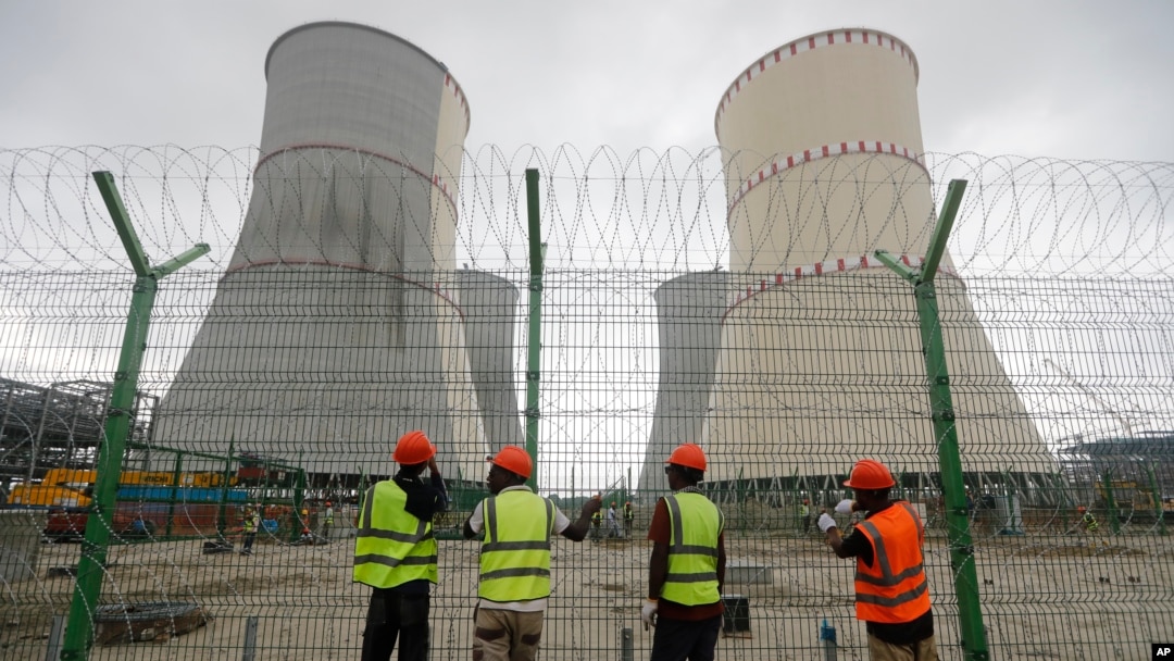 Workers fix barbed wire on a fence surrounding the Rooppur Nuclear Power Plant in Ishwardi in Bangladesh on October 4. 