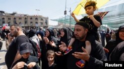 Iranian Shi'ite pilgrims pray as they attend the holy ritual of Arbaeen in Karbala on August 31.