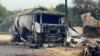 A burnt-out gas tanker on a street in the Ukrainian village of Hirsk following a Russian drone strike that killed three people on October 3. 