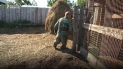 After Losing Feet, Russian Farmer Stands Strong