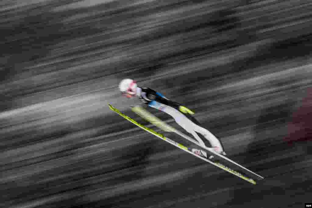 Ski jumper Evgeniy Klimov of Russia in action during a trial round of the fourth stage of the Four Hills Tournament at the FIS Ski Jumping World Cup event on the Paul Ausserleitner Hill in Bischofshofen, Austria. (epa/Christian Bruna)