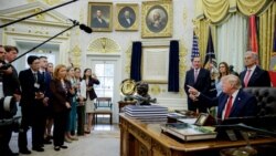 US President Donald Trump talks to reporters at the White House in Washington on September 18.