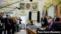 US President Donald Trump speaks to reporters at the White House on September 18.