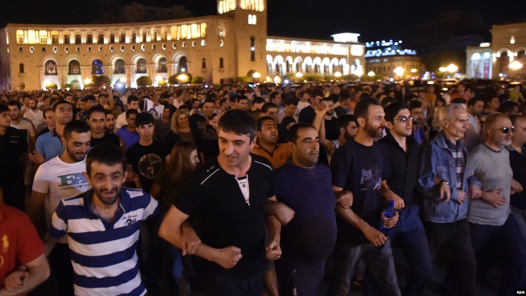 Supporters of the opposition hold a protest march in support of the gunmen in Yerevan on July 26.