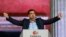 The head of the Syriza party, Alexis Tsipras, speaks to supporters in Athens after Greek parliamentary elections on January 25. 