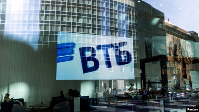 Russia - A VTB bank logo is seen on screen through a window in the Moscow International Business Center, August 12, 2022.