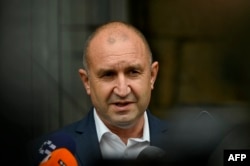 Bulgarian President Rumen Radev talks to the press after voting in presidential and parliamentary elections at a polling station in Sofia on November 14.