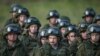 Serbia - Russian troops stand after a training exercise in the village of Nikinci, west from Belgrade, November 14, 2014