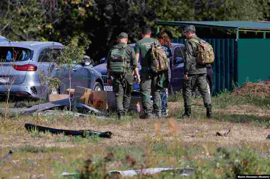 Investigators examine the site of the drone strike in Ramenskoye. As Russia continues its offensive in eastern Ukraine, Kyiv has increased its counterattacks, including cross-border strikes in Russia&#39;s western Kursk region and large-scale drone assaults deep into Russian territory.