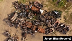 Destroyed Russian tanks and military vehicles are seen dumped in Bucha amid Russia's invasion of Ukraine on May 16.