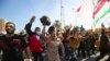 Supporters and members of the Hashed al-Shaabi paramilitary force gather during a demonstration outside the US embassy in the Iraqi capital Baghdad on January 1, 2020. 