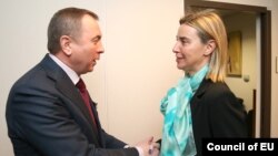 Belarusian Foreign Minister Uladzimer Makey (left) with EU foreign policy chief Federica Mogherini in Brussels late last year. 