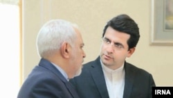 Abbas Mousavi, new spokesman of Iran's foreign ministry speaking with foreign minister Javad Zarif. Undated