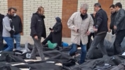 A video grab taken on January 14 from UGC images posted on social media shows dozens of bodies lying on the ground at the Tehran Province Forensic Diagnostic and Laboratory Center.