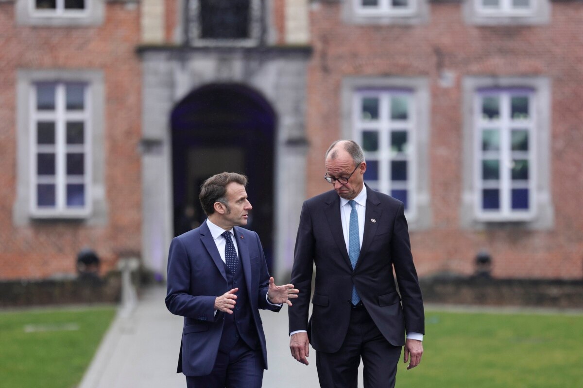 French President Emmanuel Macron and German Chancellor Friedrich Merz arrive for an informal meeting of EU leaders in Belgium on February 12, 2026.