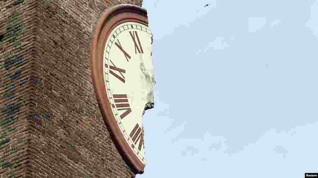 The remnants of a badly damaged clock tower remain standing after an earthquake in Finale Emilia, Italy, on May 20. (Reuters/Giorgio Benvenuti)