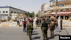 Сили безпеки Іраку на місці одного з вибухів в Іраку, 27 вересня 2016 року