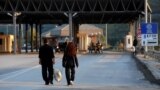 Kosovo -- A couple walk at the Kosovo-Macedonian border crossing near the town of Hani i Elezit, September 11, 2013