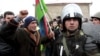 A protester shouts at a policeman during a demonstration in the central square of Quba on March 1.