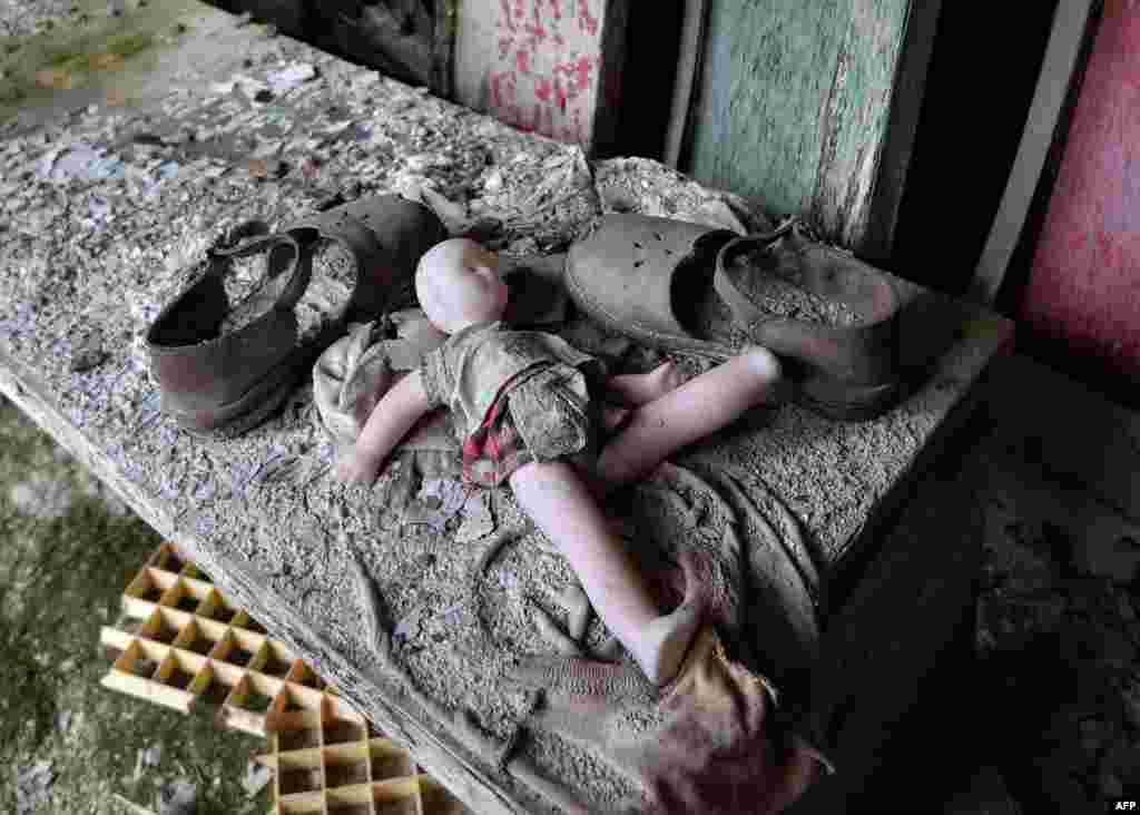 A doll and shoes lay on a bench in a nursery school in the "ghost town" of Pripyat near the Chernobyl nuclear power plant on April 24. April 26 marks the 30th anniversary of the disaster. (AFP/Genya Savilov)
