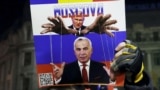 ROMANIA – A poster depicting Russian leader Vladimir Putin and Călin Georgescu, who advanced to the second round of Romania's presidential election, at a protest in the Romanian capital. Bucharest, November 25, 2024