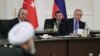 A handout photograph taken and released by the Turkish Presidential press service shows Turkish President Tayyip Erdogan (R) speaking with Iranian counterpart Hassan Rouhani (L) and Russian counterpart during a trilateral meeting on Syria, in Ankara on Se