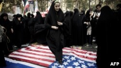 An Iranian woman stamps on a U.S. flag during a protest outside the former American embassy in Tehran in 2013. The Stars and Stripes, however, is not always treated with such contempt in Iran.