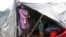 Flood victims live in temporary shelters as it rains in Muzaffarabad in the Pakistani-administered Kashmir region.