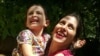 File - Nazanin Zaghari-Ratcliffe embraces her daughter Gabriella in Damavand, following her three-day release from prison, August 23, 2018