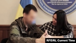 Irina Krynina meeting her partner in Ukraine after traveling from Russia when she learned he had been taken prisoner. The Russian woman decided to remain in Ukraine to help other captured Russian soldiers reconnect with their families and aid prisoners on both sides return home.
