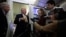 U.S. President Trump speaks to reporters aboard Air Force One en route to Joint Base Andrews