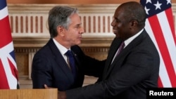 U.S. Secretary of State Blinken greets British Foreign Secretary David Lammy in London on September 10.