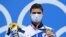 Yvgeny Rylov poses on the podium after the final of the men's 200-meter backstroke swimming event during the Tokyo 2020 Olympic Games in Tokyo on July 30, 2021.
