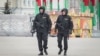 Belarus - Riot police patrol Kastrychnitskaya Square with machine guns. Minsk, 24Mar2017