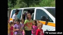 Schoolchildren from Liplje, Bosnia climb out of a minivan donated by a Dutch NGO to help them get to school. Screen shot from RFE/RL's "TV Liberty" program, 24Jul2012.