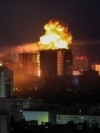 An explosion lights up the sky in Kyiv early on June 2.