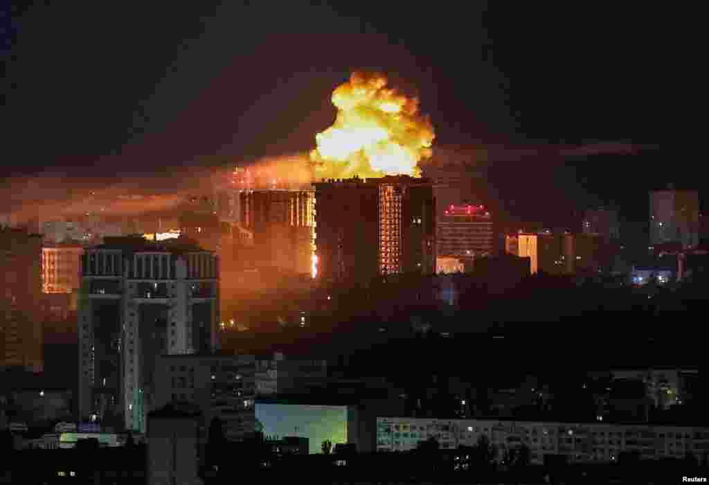 An explosion lights up the sky in Kyiv early on June 2. 