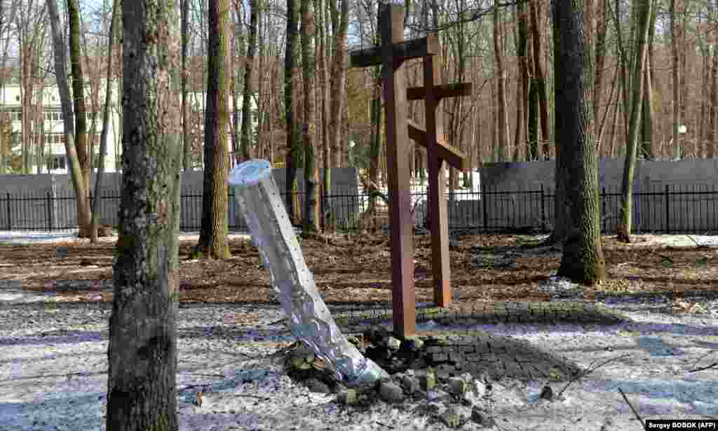 The internal frame of a Smerch rocket that possibly contained cluster bombs, photographed after slamming into the ground next to a memorial to victims of Soviet repression on the outskirts of Kharkiv on March 23. 