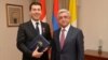 President Serzh Sargsyan awards a medal to his son-in-law and Armenian Ambassador to the Vatican Mikayel Minassian, April 5, 2018.