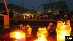 Candles were lit in front of the collapsed shopping center in Riga on November 22.