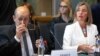 BELGIUM -- European Union foreign policy chief Federica Mogherini, right, sits next to France's Foreign Minister Jean-Yves Le Drian, during a meeting of the foreign ministers from Britain, France and Germany with the Iran Foreign Minister, at the Europa